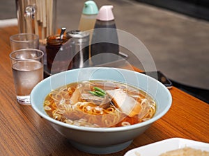 Japanese soba noodles in a hot soup with pork and green onion