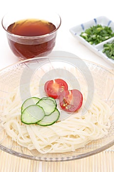 Japanese somen noodles in plate with soy sauce