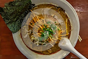 Japanese soup ramen served with chashu pork, Japanese bamboo shoots and sauteed bean sprouts, japanese leek sprinkled with thai