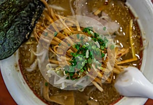 Japanese soup ramen served with chashu pork, Japanese bamboo shoots and sauteed bean sprouts, japanese leek sprinkled with thai