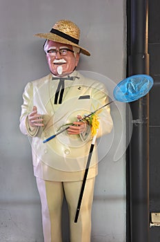 Japanese statue of Colonel Harland David Sanders in summer outfit at Akihabara.