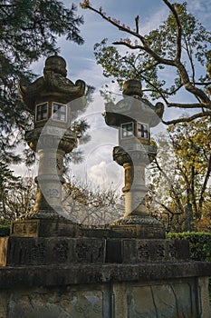 The Japanese Stone Lantern in Kitano Tenmangu Shrine in Kyoto, Japan
