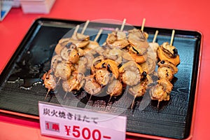 Japanese street food close up Grilled Oysters with wooden sticks