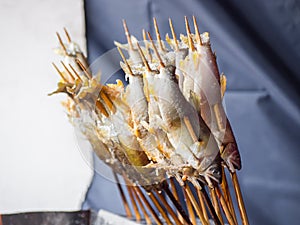 Japanese street food, Sakana Shioyaki is salt fish grilled over charcoal grill