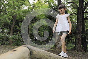 Japanese student girl on the balance beam