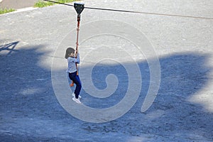 Japanese student girl playing with flying fox