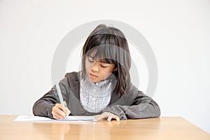 Japanese student girl studying in dining room