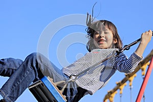 Japanese student girl on the swing