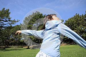 Japanese student girl throwing a ball
