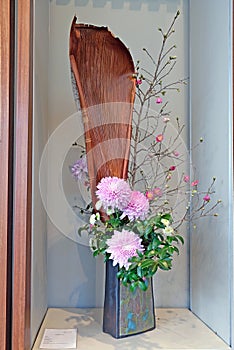 Japanese style flower arrangement ikebana isolated on white background