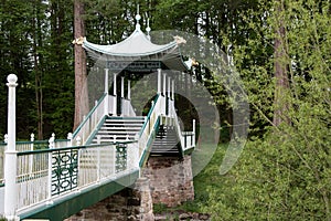 Japanese Style Footbridge Spanning a River in a Public Country Park