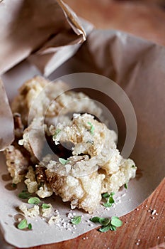 Japanese style tempura vegetables with fresh herbs and salt