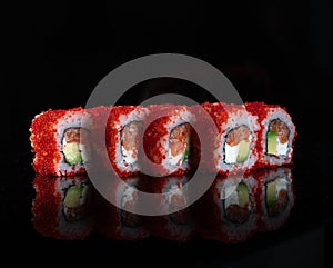 Japanese Sushi  on black background. Reflection in a mirror surface. Close up. Studio photo