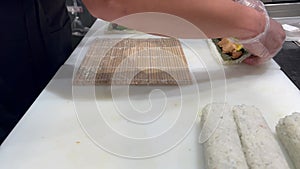 Japanese sushi chef prepare Sushi on kitchen counter top