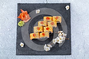 Japanese sushi food. Maki ands rolls with tuna, salmon, shrimp, crab and avocado