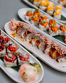 japanese sushi food. Maki ands rolls with tuna, salmon, shrimp, crab and avocado. Rainbow sushi roll, uramaki, hosomaki