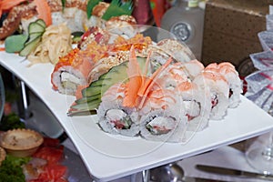 Japanese sushi food. Maki ands rolls with tuna, salmon, shrimp, crab and avocado. Rainbow sushi roll, uramaki, hosomaki and nigiri