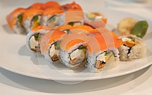 Japanese sushi food. Philadelphia roll sushi with salmon, avocado, cream cheese. Sushi menu. View of assorted sushi