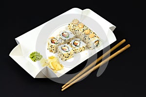 Japanese sushi rolls in white eco paper disposable box