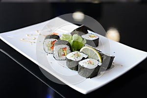 Japanese sushi on a white plate.