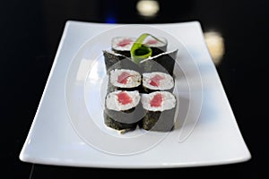Japanese sushi on a white plate.