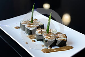 Japanese sushi on a white plate.