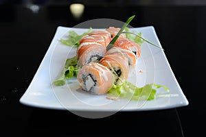 Japanese sushi on a white plate.