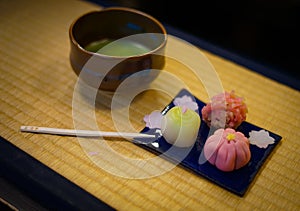 Japanese sweets and green tea that has been placed on the tatami