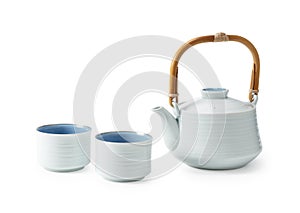 Japanese teacups and teapots placed against a white background