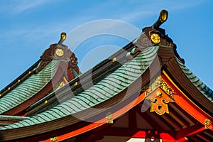 Japanese temple roof with blue sky in the background