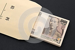 Japanese ten thousand yen in a salary bag