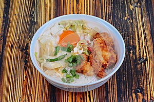 Jasmine rice with deep fried Chicken topped soft boil eggs and