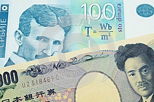 A Japanese thousand yen note paired with a bue and white one hundred Serbian dinar note.