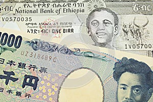 A Japanese thousand yen note paired with a grey Ethiopian one birr bill.