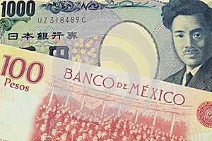 A Japanese thousand yen note paired with a red and yellow one hundred peso bill from Mexico.