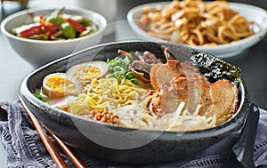 Japanese tonkotsu ramen bowl on dinner table at restaurant