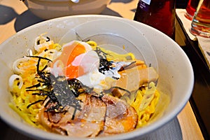 Japanese tonkotsu ramen topped with seaweed, eggs and pork