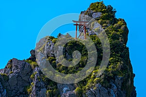 Japanese Torii Gate and Rope on Sea Stack