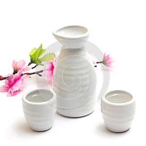 Japanese traditional sake cups and bottle with sakura