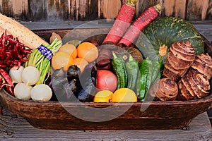 Japanese traditional vegetables in wooden basket.