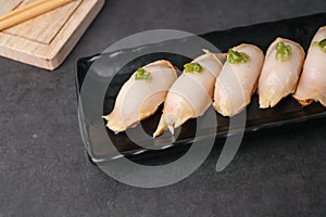 Japanese traditionanigiri made with raw fish and wasabi