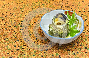 Japanese Tsubo-yaki steamed Sazae horned turban sea snail with maple momiji leaves.