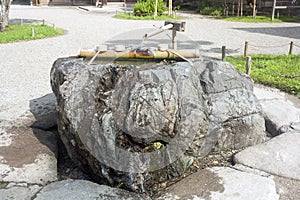 Japanese Tsukubai: Stone Basin for Purification at Chusonji Temple in Hiraizumi
