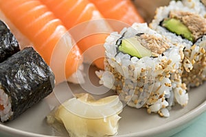 Japanese tuna avocado inside out California with salmon Nigiri and Maki on sushi mix plate