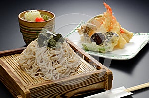 Japanese Udon noodle with seaweed and shrimp tempura on bamboo t