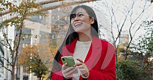 Japanese woman, city and laugh with phone for reading funny notification, social media post and download digital app