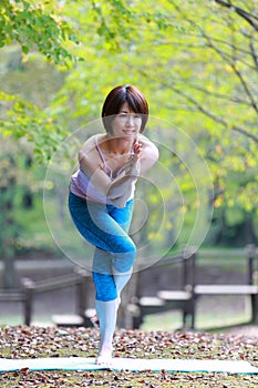 Japanese Woman Doing YOGA eagle pose