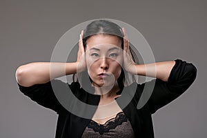 Japanese woman hears no evil