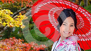 Japanese Woman in A Japanese Garden in Autumn