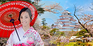 Japanese woman in Kimono Dress with Full bloom Sakura - Cherry Blossom at Aizuwakamatsu Castle and cherry blossom